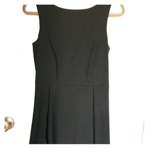 Black sleeveless knee length dress